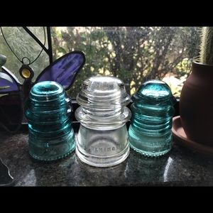 Three antique Hemingray insulators.